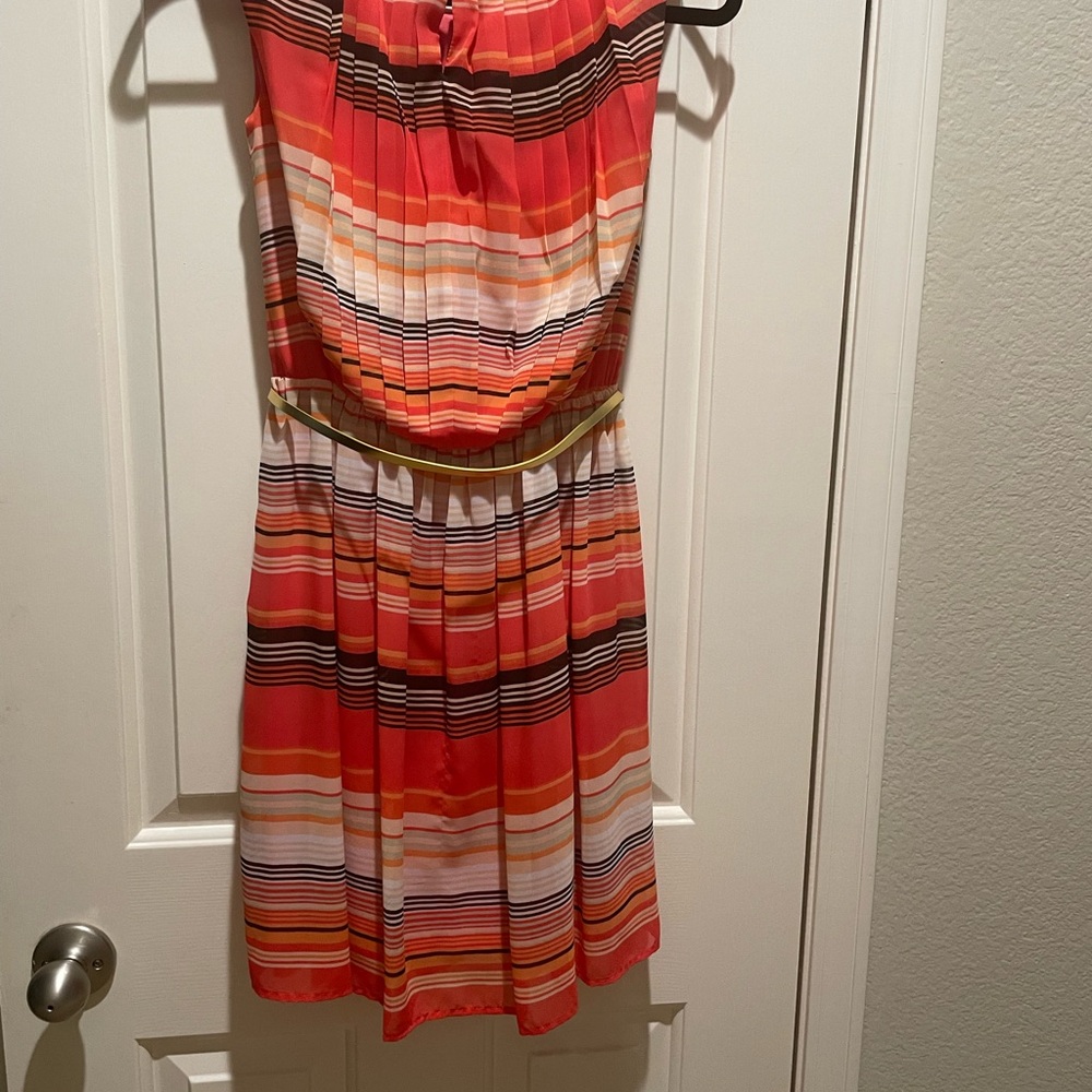 This colorful pleated dress can brighten up your wardrobe.